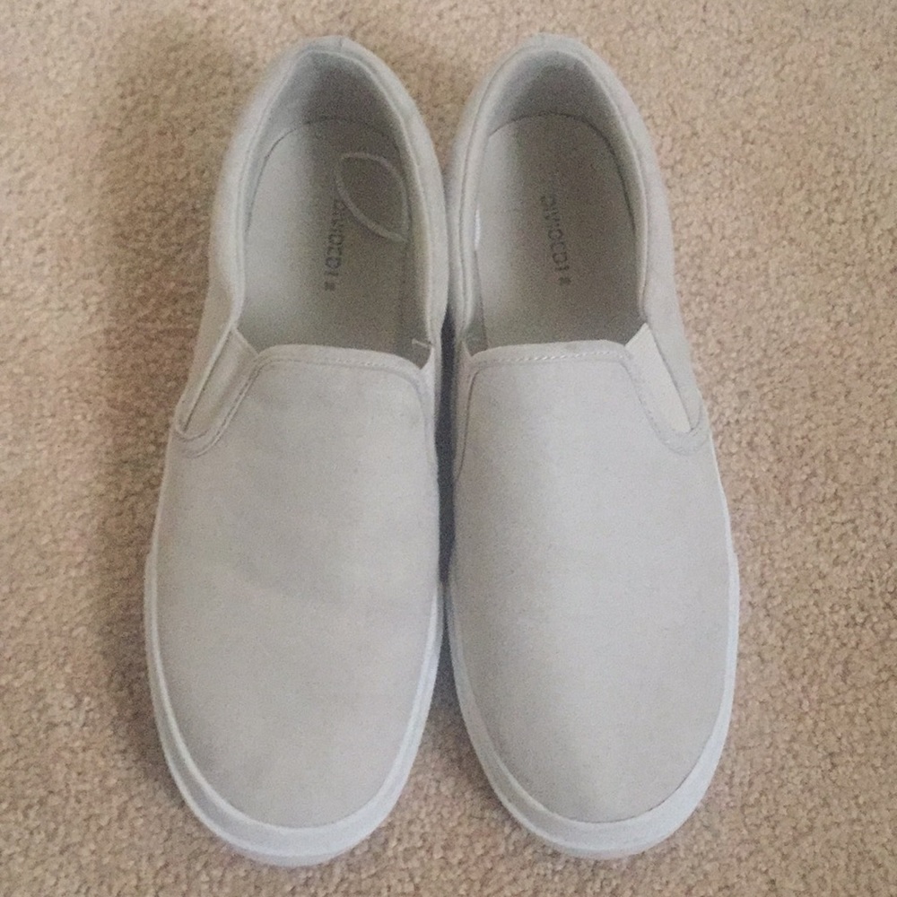 Cream-colored slip on casual sneakers